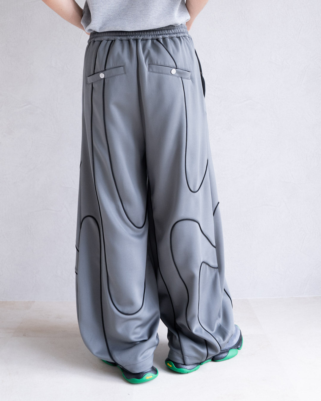 DISTORT PIPING TRACK PANTS