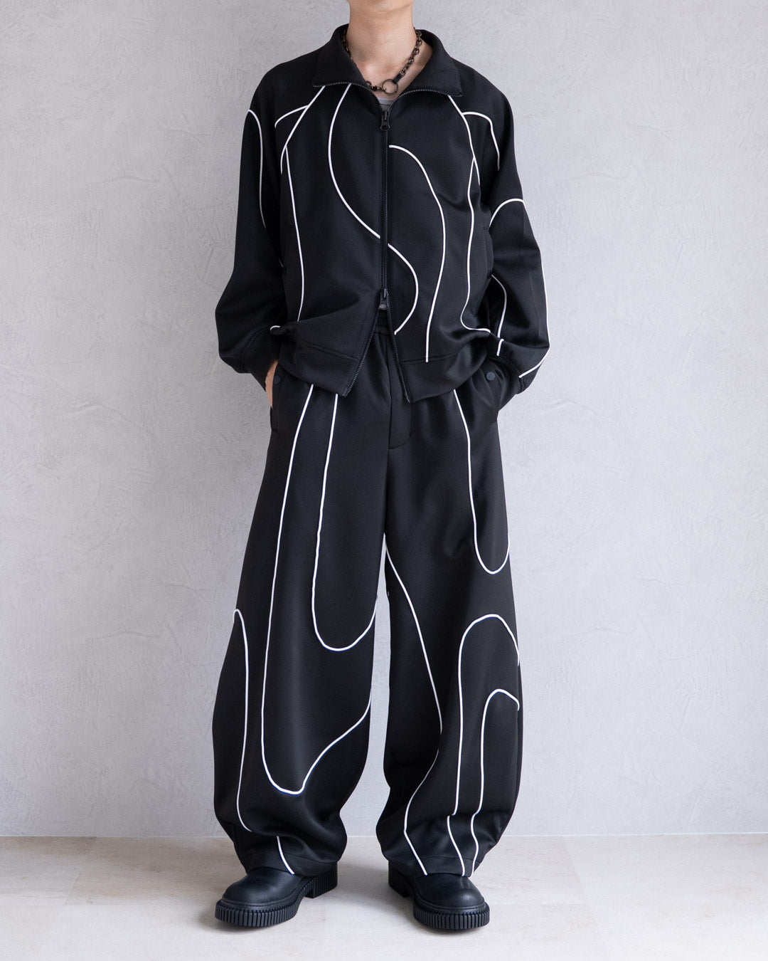 DISTORT PIPING TRACK PANTS