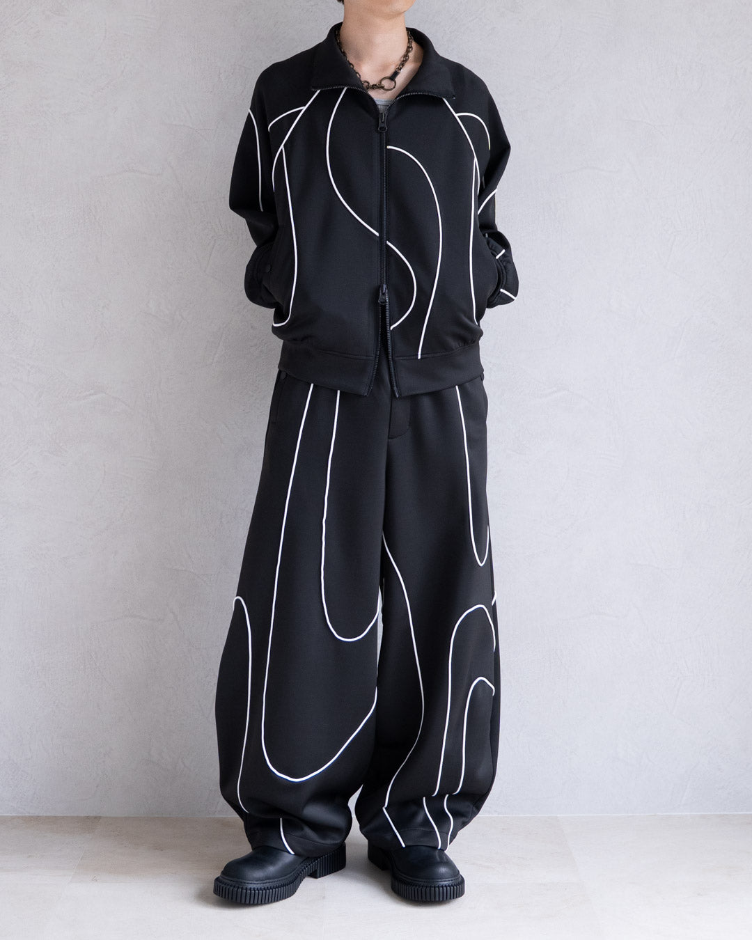 DISTORT PIPING TRACK PANTS