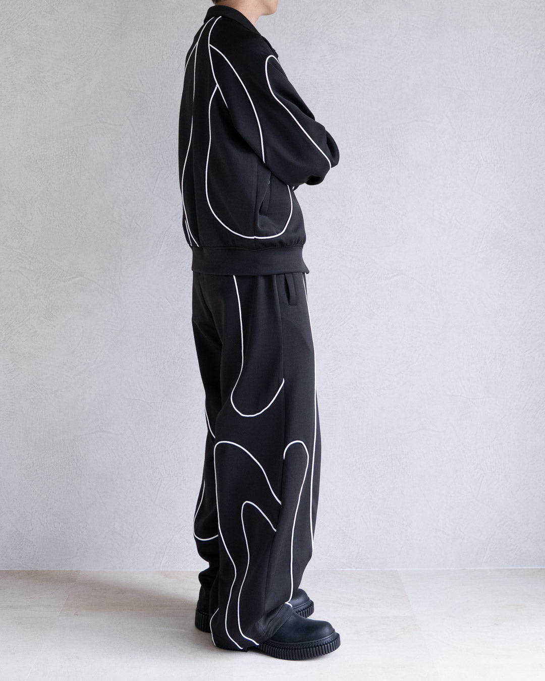 DISTORT PIPING TRACK PANTS