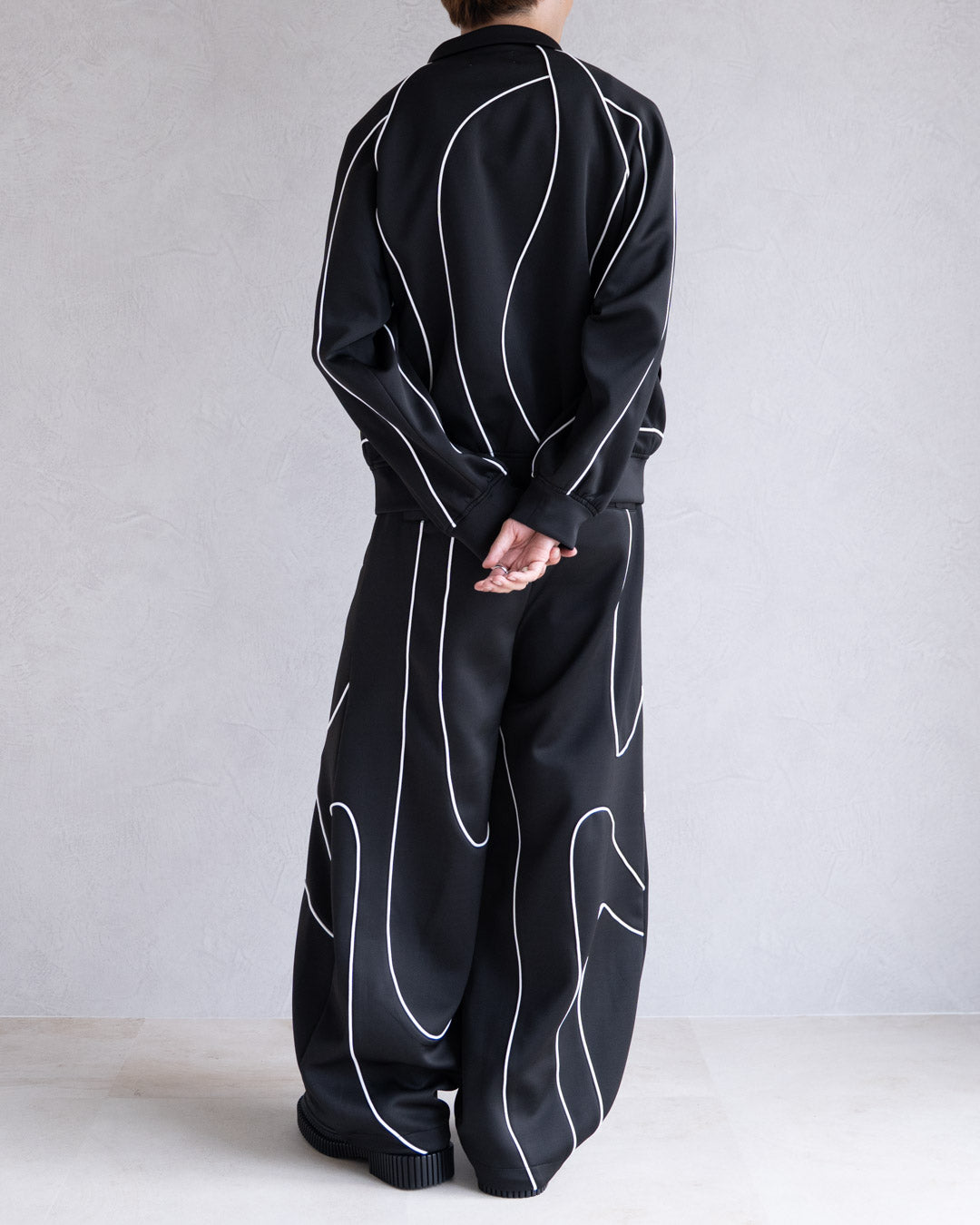 DISTORT PIPING TRACK PANTS