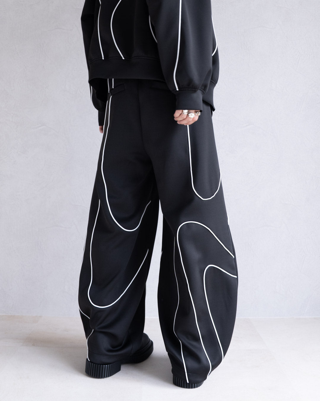 DISTORT PIPING TRACK PANTS